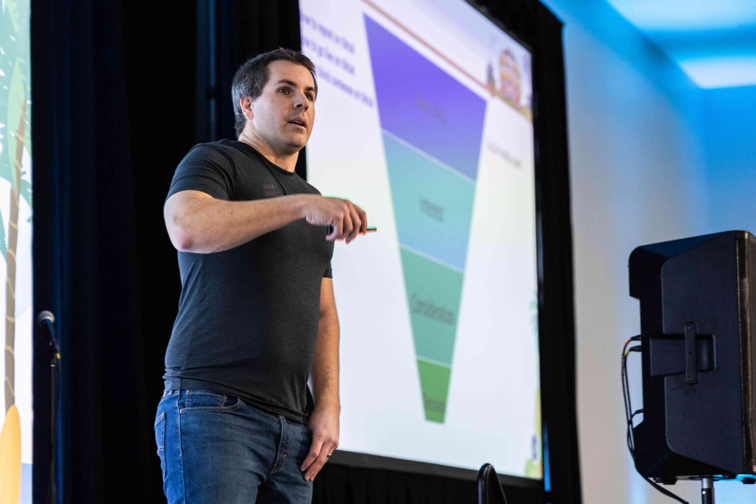 Jeff Oxford presenting an eCommerce marketing funnel on stage at an industry conference.